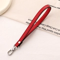 Detail of red lychee grain leather wrist strap with silver metal spring buckle and rivet - Cross Pattern Leather Hanger / Red