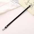 Close-up of black PU leather bag strap with silver metal lobster clasps and rivets - Cross Pattern Leather Hand Chain / Black