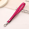 Close-up of magenta PU leather wrist strap with silver metal lobster clasp and rivets - Cross Pattern Leather Hanger / Rose Red