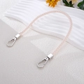 Detail of hand-woven light pink leather strap with silver lobster clasps for bags or phones - White