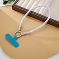 Close-up of light blue floral print PU leather phone strap with silver metal ring and pad - Phone Strap / Blue (K5221)