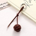 Detailed view of hand-woven dark brown leather ball charm with silver spring metal ring clasp - Dark Brown Braided Ball (K5252)