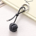 Detail of hand-woven dark gray PU leather ball bag charm with silver metal spring ring - Dark Gray Braided Ball (K5255)