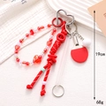 Ciondolo in corda intrecciata colorata con racchetta da ping pong e perle a cuore - Rosso