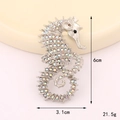 Silver seahorse brooch with colorful aurora rhinestones, measures 6x3.1cm and 21.5g - D3283 Seahorse (Silver AB)