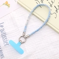 Detailansicht der hellblauen Denim-Handy-Handschlaufe und silberner Metallring-Schnalle - Himmelblau
