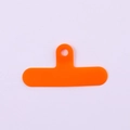 Close-up of orange PVC phone lanyard tether tab with reinforced circular hanging hole - Clip / Orange