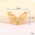 Macro shot of gold heart-shaped hand gesture charm with 4.3cm width and 2.7cm height - Hands Heart (Gold) (D3259)