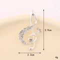 Detailed view of a silver violin brooch with clear rhinestones showing dimensions 3.9cm x 2.2cm - Rhinestone Musical Note (Silver) (D3260)