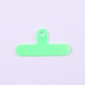 Detail of mint green T-shaped PVC phone lanyard patch with round metal hanging hole - Clip / Green