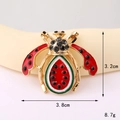 Macro view of vintage bee charm featuring watermelon enamel body and black rhinestone details - Gold Base Red Watermelon Bee