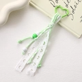Detail of light green woven cord keychain with heart lace and acrylic beads - Lace Hollow Heart Braided Pendant / Light Green