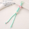 Porte-clés en nylon tissé à la main vert menthe avec détails roses et charme K - Bleu lac