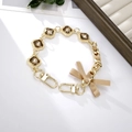Handwoven gold chain with brown gemstones and a silk bow for bags or phones - Rhinestone Ribbon Bow Hand Chain Champagne