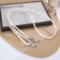 Detail of cream PU leather strap with silver foil accents and rotating metal clasps - Light Yellow