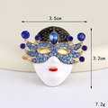 Detailed view of Venetian mask brooch with blue crystals and size markings of 3.5cm by 3.2cm - Gold Blue Ball Mask (D3312)