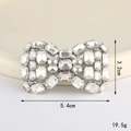 Close-up of silver-tone bow pendant accessory with sparkling clear rhinestones - Rhinestone Bow (Silver White) (D3334)