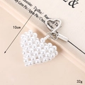 Handmade heart-shaped pearl bag charm with a silver Good Luck tag and metal clasp - Pearl Heart Pendant (With Tag) / Pearl White Heart Style With Tag (K5491)