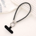 Close-up of luxury black rhinestone wrist strap with silver ring clasp and phone tether tab - Black