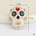 Detail of Sugar Skull charm with heart eyes measuring 2.3cm by 3.1cm for DIY jewelry - Gold White Enamel Sugar Skull (D3316)