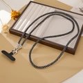 Elegant black rhinestone phone lanyard with silver lobster clasps on a jewelry tray - Black
