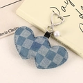 Close-up of blue checkered denim heart charm with silver clip and pearl detail - Blue Plaid
