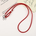 Detail of red braided PU leather phone lanyard with silver metal lobster clasps and rings - Dark Red