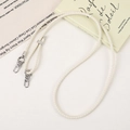 Close-up of cream woven PU leather lanyard with silver metal lobster clasp and ring detail - White