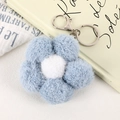 Charmant porte-clés fleur en peluche bleu et blanc avec fermoir mousqueton en métal argenté - Bleu