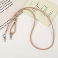 Close-up of beige woven PU leather lanyard with silver metal lobster clasps for bags - Khaki