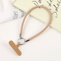 Close-up of a light brown PU leather braided phone wrist strap with metal ring and T-shaped pad - Khaki