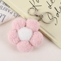 Detailed view of a soft plush pink flower keychain with shiny silver metal lobster clasp - Pink