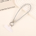 Detailed view of luxury square rhinestone wrist phone strap with silver spring clip and gasket - White