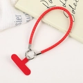 Detail of red braided wrist strap with silver ring clip and phone tether tab - Red