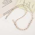 Detail of adjustable beige hand-woven crossbody phone lanyard with silver metal hardware - Crossbody Chain / Creamy White (K5532)