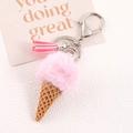 Detail of pink faux fur ice cream keychain with brown cone and leather tassel - Pink