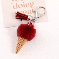 Detail of red faux fur ice cream keychain with resin cone, tassel and silver clasp - Burgundy