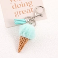 Detail of mint green pompom ice cream keychain with brown cone and leather tassel charm - Mint Green