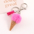 Detail of pink faux fur ice cream keychain with waffle cone, tassel and silver clasp - Rose Red