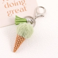 Detail of light green faux rabbit fur ice cream keychain with tassel and silver clasp - Grass Green