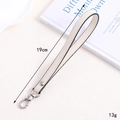 Chic white leather wrist strap for handbags and phones with silver metal spring buckle - Cross Pattern Leather Hanger / Off-white