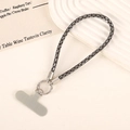 Detail of luxury rhinestone phone wrist strap with silver ring and gray securing pad - Gray