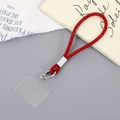 Dettaglio del cinturino da polso con strass rossi, moschettone argento e inserto PVC - Rosso