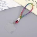 Close-up of rainbow rhinestone wrist strap with silver metal clasp and clear patch - Colorful