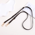 Detail view of dark brown lychee leather bag strap with adjustable gold buckle and hooks - Dark Brown