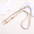Adjustable cream lychee leather bag strap with golden hardware and lobster clasps - Off White