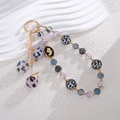 Leopard print plush ball phone strap with beaded charms and golden relief pendant - Gray
