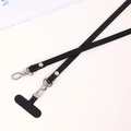 Macro detail of PU leather crossbody phone strap with Greca pattern and silver buckle - Black Meander