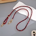 Detail view of leopard print leather phone strap with adjustable gold lobster clasps - Crossbody Chain / Red Leopard (K5791)