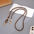 Close-up of leopard print PU leather strap with golden metal lobster clasps and rings - Crossbody Chain / Coffee Leopard (K5788)